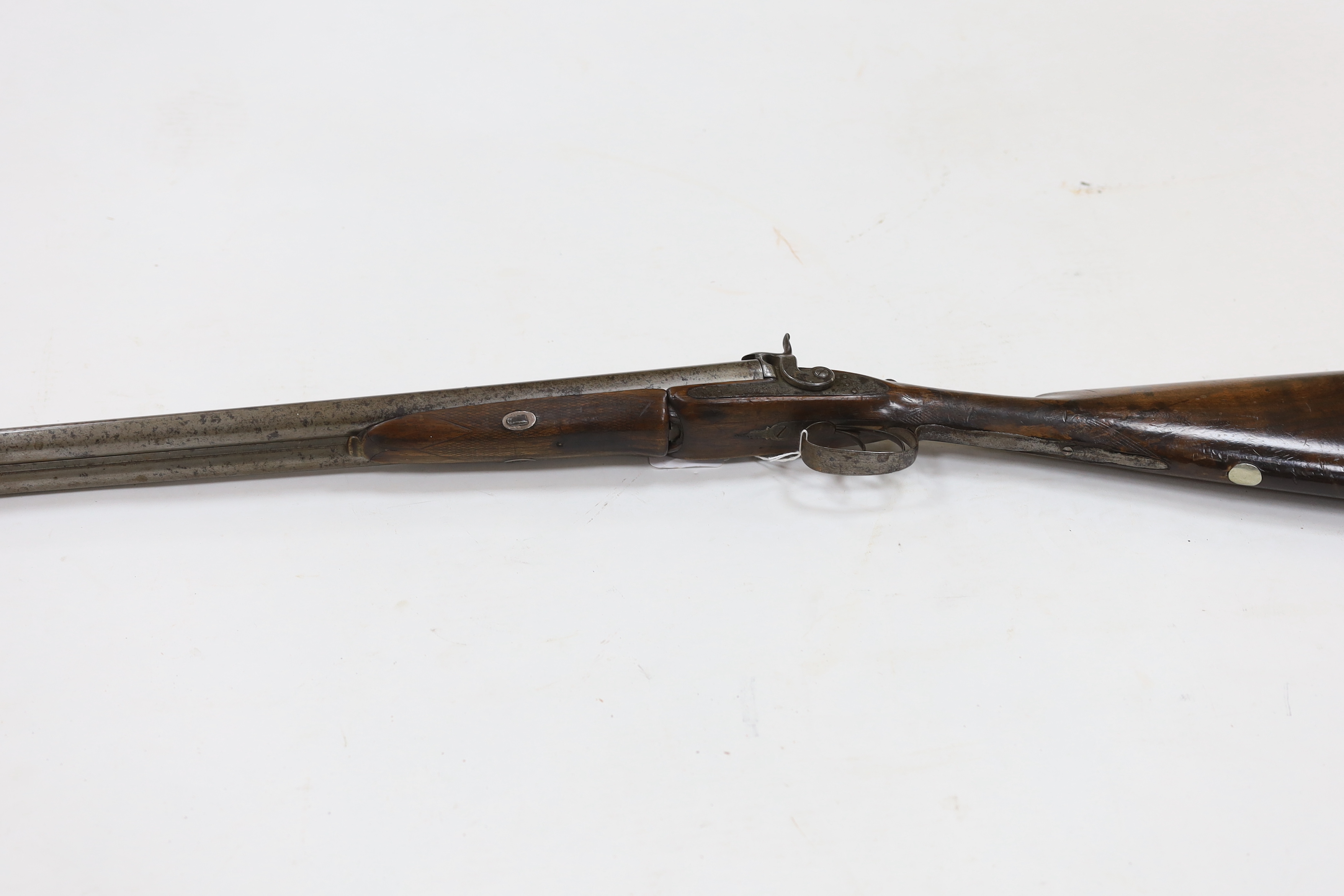 A double barrel pinfire shotgun by Wesley Richards with patent knuckle joint and top lever, barrels 74.5cm